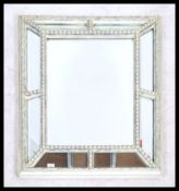 A 20th century Venetian style cushion mirror. Of rectangular form with mirror panel cushion sides