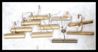 A collection of 20th century wall painting / picture lights of elongated cylindrical form with