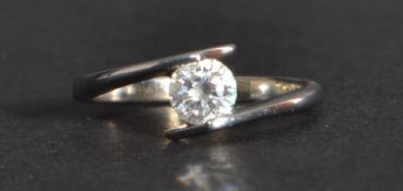 An 18ct white gold single stone solitaire diamond ring of approx 35pts. Size K weighs 3.7 grams.