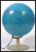 A mid century desk top globe by Scanglobe depicting the night sky, constellations and stars.