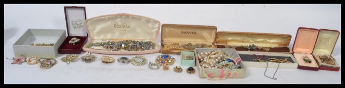 A good collection of vintage costume jewellery to include marcasite brooches , glass bead