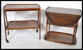 A retro teak wood 20th century two tier buffet trolley by Remploy in the Danish manner together with