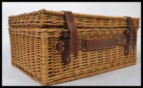 A vintage 20th century retro wicker picnic hamper and contents. The basket fitted with glasses ,