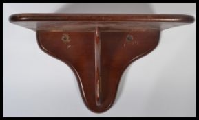 A 19th century Victorian mahogany wall mounted metamorphic drop dowm clock bracket / shelf. Measures