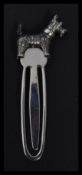 A sterling silver bookmark having a West Highland Terrier dog finial top. Weighs 11.7 grams.