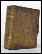 A vintage 20th century brass advertising vesta case in the form of a book with notation for D.