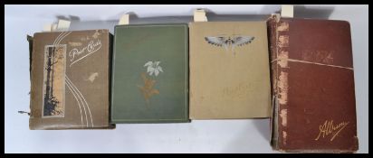 Postcard collections in antique albums (4). Two albums x300 cards, one x396 and a giant album x800