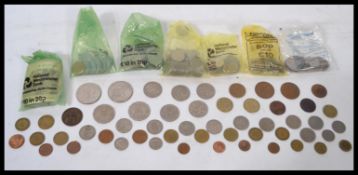 A collection of vintage 20th century bank notes and coinage to include Great Britain and many