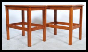 A pair of 1970's retro teak wood and tile top Danish influence lamp tables. Each with inset tiles