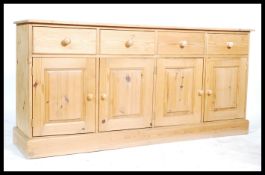 A good quality antique style pine dresser. The base with long plinth having a series of short