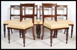 A set of six Edwardian mahogany dining chairs, overstuffed seats recently being reupholstered raised
