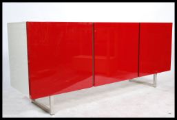 A contemporary two tone sideboard by Calligaris, the white body with an arrangement of cupboard