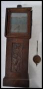 A late 19th / early 20th century tabletop Apprentice's oak cased longcase clock, with brass face.