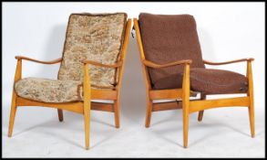 A pair of retro mid 20th century Danish inspired armchairs in the manner of Scandart, having cushion