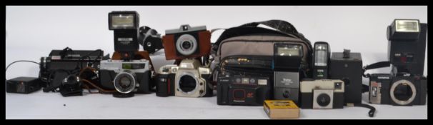 A good collection of vintage camera's to include Nikon, Olympus, mid century cine cameras, Koadak
