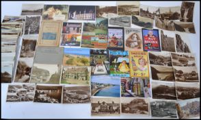 A collection of postcards dating from the early 20th century many of vistas and architectural