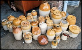 A large collection of 19th and 20th century stoneware pots, ewers, flagons etc. Predominately from