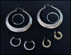 A selection of four pairs of 925 silver hoop earri