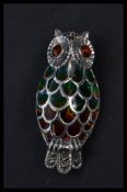 A sterling silver plique a jour brooch in the form of an owl. Weighs 7.8 grams.