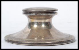 A silver hallmarked Capstan inkwell by Walker & Hall with sheffield hallmarks, date letter