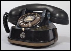 An early 20th century FTR Belgian black telephone handset having good shape with central finger ring