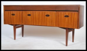 A 1960's retro teak wood Danish influence sideboard in the manner of Robert Heritage for Archie