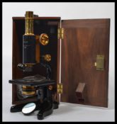 A vintage early 20th century cased W. Watson & Sons Ltd 