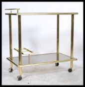 A vintage 20th century good quality Italian brass and glass drinks trolley  raised on the original