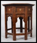 An Eastern / Persian 19th century octagonal Benares table profusely inlaid with mother of pearl