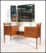 A retro 20th century twin pedestal dressing table having an arrangement of drawers, drop centre