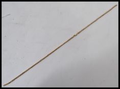 A 9ct gold herringbone link necklace chain having a lobster claw clasp. Weighs 5.7 grams.