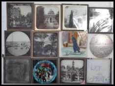 A collection of vintage early 20th century hand coloured glass plate magic lantern slides to include