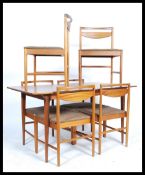 A 1960's retro 20th century Macintosh of Kirkcaldy teak dining suite comprising extending dining