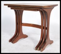 A retro 20th century nest of three E Gomme for G-Plan teak tables, the rectangular tops on
