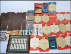 A collection of vintage 20th century cigarette and tea cards together with an 18th century framed