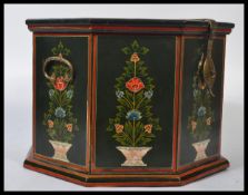 A 20th century decorative folk painted wooden octagonal storage box, fitted hinged lid to the top