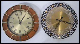 Two vintage 20th century retro wall clocks one being a Wiemar GAR example and the other being a