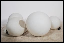 A collection of 3 20th century retro glass ceiling lights, each of white frosted glass globular form