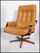 Westnofa - A 20th century retro bentwood swivel lounge armchair having a light tan button backed pad