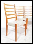 A good set of retro 1960's teak wood dining chairs by Svegards Markaryd being raised on turned and