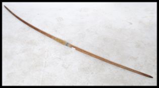 A large early 20th century wooden long box / sports bow with grip handle. Measures: 180cm long