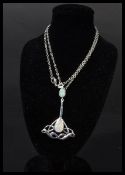 A sterling silver opal art deco style pendant necklace complete in presentation box.