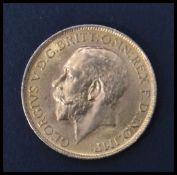 A George V 1918 gold sovereign coin with Bust Front, St George & Dragon verso. Total weight 7.98g