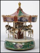 A 20th century musical ceramic novelty fully functional ceramic fairground carousal with applied