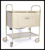 A mid century Industrial, believed medical hospital serving trolley. Tubular metal construction with