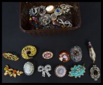 A collection of approx 26 vintage 20th century brooches to include Italian micromosaic , cameo ,