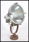 A large vintage 20th century retro industrial search lamps light  on cast metal base with polished