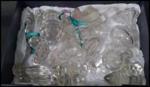 A collection of antique 19th century cut glass decanter stoppers and  knife rests in various sizes