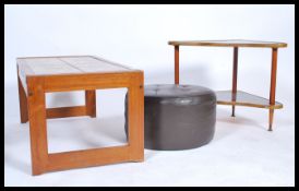 A retro 1970's teak wood and tile top rectangular coffee table together with a mid century