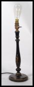 A 19th century Victorian chinoiserie table lamp being ebonised with raised detailing of